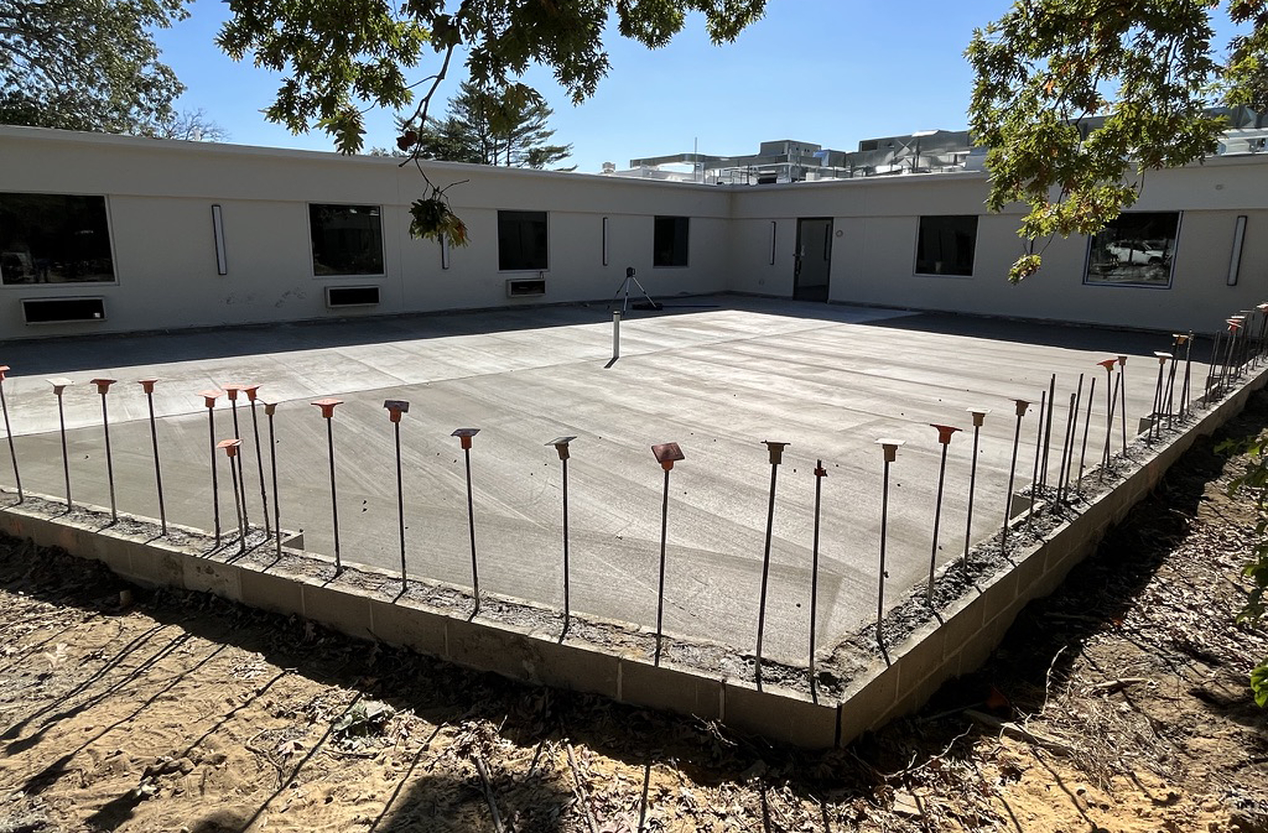 Poured foundation slab with rebar dowels ready for waterproofing